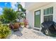 Inviting outdoor patio featuring a grill and ample seating perfect for relaxing or entertaining at 202 S Tampania Ave # 3, Tampa, FL 33609