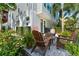 A relaxing patio area with comfortable seating surrounded by lush landscaping for outdoor enjoyment at 202 S Tampania Ave # 3, Tampa, FL 33609