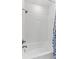 Clean and well-maintained white tile shower and tub combination with chrome fixtures at 202 S Tampania Ave # 3, Tampa, FL 33609