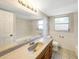 Bathroom vanity with sink, mirror and updated lighting at 204 Cove Ct, Clearwater, FL 33756