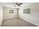 Bedroom with carpet flooring, a ceiling fan and natural light at 204 Cove Ct, Clearwater, FL 33756