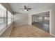 Dining area with tile flooring, a ceiling fan and view into the living room at 204 Cove Ct, Clearwater, FL 33756