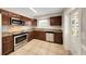 Modern kitchen with stainless steel appliances, granite countertops, and custom cabinetry at 204 Cove Ct, Clearwater, FL 33756
