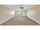 Cozy living room featuring neutral walls, carpet flooring, and a ceiling fan at 204 Cove Ct, Clearwater, FL 33756