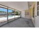 View of the screened patio with pool in the background, offering a relaxing outdoor space at 204 Cove Ct, Clearwater, FL 33756