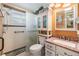Bathroom featuring a walk-in shower, tile accents, and granite countertops at 2308 Rio Cir, Spring Hill, FL 34608