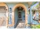 Charming doorway with an arched portico and decorative details at 2308 Rio Cir, Spring Hill, FL 34608