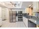 Bright kitchen featuring stainless steel appliances, granite countertops, and double sink at 2308 Rio Cir, Spring Hill, FL 34608