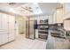 Bright kitchen with stainless steel appliances, granite countertops, and mosaic tile backsplash at 2308 Rio Cir, Spring Hill, FL 34608