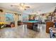 Spacious living room with a pool table and lots of natural light at 2308 Rio Cir, Spring Hill, FL 34608
