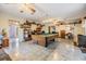 Spacious living room with a pool table and tile flooring, perfect for entertainment at 2308 Rio Cir, Spring Hill, FL 34608