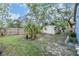 The backyard includes a shed and features some plants at 2308 Rio Cir, Spring Hill, FL 34608