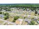 Aerial view of neighborhood with new construction homes and mature tree coverage at 27017 Mott Ave, Brooksville, FL 34602