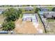 Home foundation in progress with concrete block walls and other homes nearby at 27017 Mott Ave, Brooksville, FL 34602
