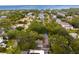 Aerial view of the neighborhood with mature trees and partial water view at 2933 W Alline Ave, Tampa, FL 33611
