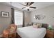 Calming bedroom with a hanging chair, soft textures, and a cozy atmosphere at 2933 W Alline Ave, Tampa, FL 33611
