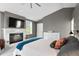 Comfortable bedroom with a fireplace, gray walls, light gray carpet, and a ceiling fan at 2933 W Alline Ave, Tampa, FL 33611