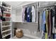 Organized walk-in closet with shelving, hanging rods, and storage baskets for shoes and clothing at 2933 W Alline Ave, Tampa, FL 33611