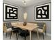 Stylish dining area featuring a built-in bench, modern table, contemporary artwork, and sleek decor at 2933 W Alline Ave, Tampa, FL 33611
