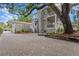 Exterior showcasing the brick paved driveway and lush landscape at 2933 W Alline Ave, Tampa, FL 33611