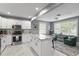 Well-lit kitchen featuring an island, stainless steel appliances, and an open concept layout at 2933 W Alline Ave, Tampa, FL 33611