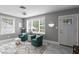 Cozy living room featuring natural light, plush seating, and neutral paint, great for relaxation at 2933 W Alline Ave, Tampa, FL 33611
