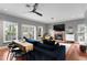 Spacious living room with a fireplace, a large TV, and comfortable furnishings at 2933 W Alline Ave, Tampa, FL 33611