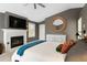 Elegant main bedroom features a fireplace, TV, dresser and a cozy ambiance with natural light at 2933 W Alline Ave, Tampa, FL 33611
