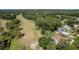 Expansive view featuring lush green golf course next to residential neighborhood with tree lined streets at 3071 Bolt Dr, Palm Harbor, FL 34685