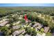 Neighborhood view showcasing the home's location near lush trees, community pool and golf course at 3071 Bolt Dr, Palm Harbor, FL 34685