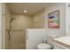 Modern bathroom featuring a walk-in shower with grab bars, white tile, and ample space for accessibility at 3071 Bolt Dr, Palm Harbor, FL 34685