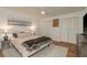 Bright bedroom with plush rug, ceiling fan, and double closet doors providing ample storage space at 3071 Bolt Dr, Palm Harbor, FL 34685