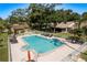 Inviting community pool featuring ample seating and a well-maintained deck, ideal for socializing and enjoying sunny days at 3071 Bolt Dr, Palm Harbor, FL 34685