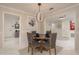 Cozy dining room with a round table and stylish lighting at 3071 Bolt Dr, Palm Harbor, FL 34685