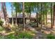 Beautiful home nestled among mature trees with a screened in porch and private backyard at 3071 Bolt Dr, Palm Harbor, FL 34685
