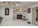 Living room fireplace features a decorative marble surround and shelving at 3071 Bolt Dr, Palm Harbor, FL 34685