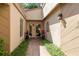 Inviting front entrance featuring mature landscaping and neutral paint scheme at 3071 Bolt Dr, Palm Harbor, FL 34685