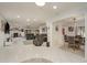 Spacious living room features an open floor plan, fireplace, and tile floors at 3071 Bolt Dr, Palm Harbor, FL 34685