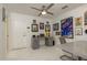 Multi-purpose space with a desk, gallery wall, and table with chairs at 3071 Bolt Dr, Palm Harbor, FL 34685
