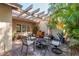Outdoor patio with ample seating and a fire pit, great for entertaining guests at 3071 Bolt Dr, Palm Harbor, FL 34685