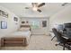 Bedroom featuring a wooden bed frame, neutral decor, and a window letting in natural light at 31643 Colada Drift Way, Wesley Chapel, FL 33545