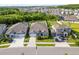Front exterior showcasing the home, landscaping, and multi-car driveway at 31643 Colada Drift Way, Wesley Chapel, FL 33545