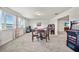 Game room with arcade games, a round chess table, and a view to the television room at 31643 Colada Drift Way, Wesley Chapel, FL 33545