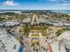 Bustling city aerial view with roundabout, lush trees, city buildings and open ocean in the background at 321 N Boulevard Of The Presidents, Sarasota, FL 34236
