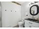 Neutral bathroom with white fixtures, black granite counter and decorative touches at 3227 Rose Arbor Dr, Hernando Beach, FL 34607