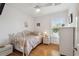 Comfortable bedroom with hardwood floors, natural light, and calming neutral decor at 3227 Rose Arbor Dr, Hernando Beach, FL 34607