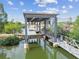 Boat lift on the canal with lush surroundings and calm waters at 3227 Rose Arbor Dr, Hernando Beach, FL 34607