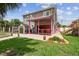 This home has a cozy outdoor dining area, shed, and a lovely landscaped yard at 3227 Rose Arbor Dr, Hernando Beach, FL 34607