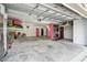 The spacious garage offers ample storage, a bicycle, and an array of tools at 3227 Rose Arbor Dr, Hernando Beach, FL 34607