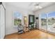 Bright and airy office space with bamboo floors, plantation shutters, and a view to the outside at 3227 Rose Arbor Dr, Hernando Beach, FL 34607